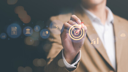 Leinwandbilder - businessman holding darts, and focus on financial goals, assessment planning and review the budget, financial and investment concepts, business growth, Liquidity management and control