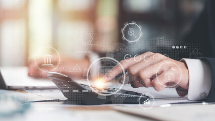 Aufkleber - Businessman calculating figures in company financial documents with a calculator,analysis of company financial data,Planning to assess and review budgets,concept of finance and investment