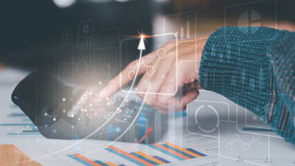 Aufkleber - Businessman calculating figures in company financial documents with a calculator,analysis of company financial data,Planning to assess and review budgets,concept of finance and investment