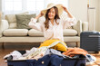 © Art_Photo - Portrait of beauty asian traveler woman packing stuff and outfit clothes in suitcases travel bag luggage for summer holiday weekend tourist vacation trip at home. travel concept