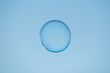 Soap bubble floating against clear blue sky close-up view