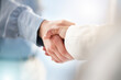 © Mia B/peopleimages.com - Hand, handshake and partnership for trust, unity or deal in agreement, meeting or b2b at office. People shaking hands in collaboration for support, welcome or promotion in solidarity at workplace