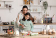 © Pixel-Shot - Little girl and her mother making dough for Easter cake in kitchen