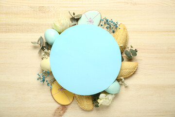 Blank card with flowers, eggs and treats on light wooden background. Novruz Bayram celebration