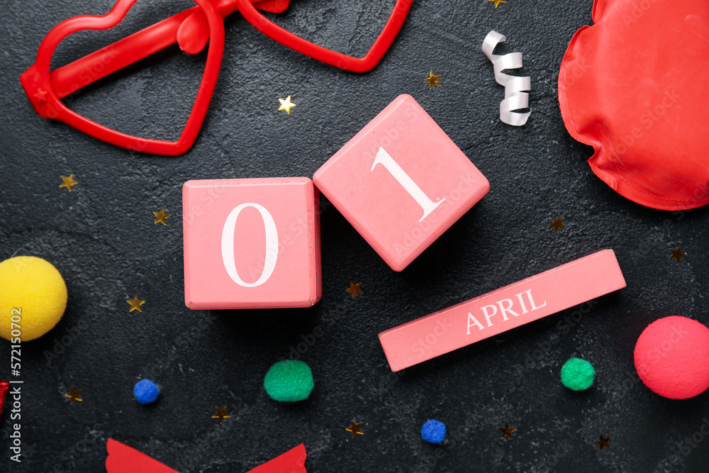 Date 1 APRIL with party decor for Fools' Day celebration on dark background