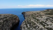 Hidden Beach Cove Valley In Malta, Ghasri, Gozo Mediterranean Island Wide View Of Sea On Clear Summer Day.