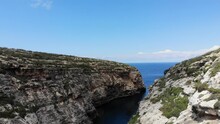 Malta, Gozo Mediterranean Island Għasri Valley Sea Canyon, Aerial View Of Rocky Cliff Beach
