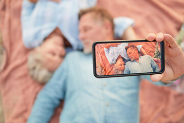 Wall Mural - Relax, love and selfie with phone screen and old couple on picnic for bonding, anniversary and celebration. Happy, technology and picture with senior man and woman for health, social media and summer