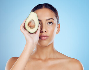 Wall Mural - Avocado wellness, studio portrait and woman with healthy skincare for face, beauty and vegan makeup. Model, green fruits and natural cosmetics for detox, facial nutrition and aesthetic glow benefits