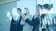 © M Stocker - A group of young Asian businesspeople meeting, discussing and present growth data of the company on modern board touch screen