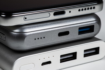 Two powerbank and smartphone on white background