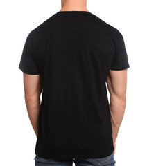Wall Mural - Man wearing black t-shirt on white background, back view. Mockup for design