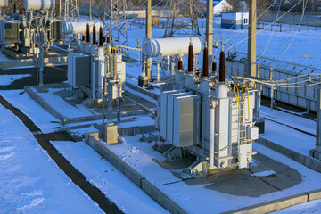 Aerial view of a high voltage electrical substation in winter season.