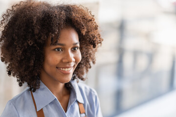 Wall Mural - Successful african woman in apron standing coffee shop door. Happy small business owner holding tablet and working. Smiling portrait of SME entrepreneur seller business standing with copy space.