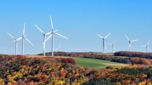 Wind Turbines On Wind Farm On Hillside Landscape Generating Sustainable Energy Electric Power For American Homes And Business 