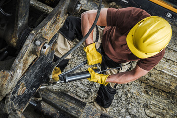 Wall Mural - Industrial Machinery Technician with Hand Pump Grease Gun