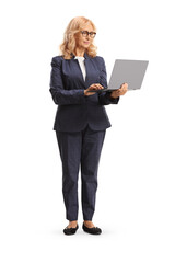 Wall Mural - Mature professional woman standing with a laptop