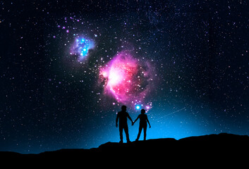 Wall Mural - Silhouette of a lovers standing hill and looking on the starry sky with Orion galaxy. Fantasy landscape.