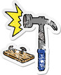 distressed sticker cartoon doodle of a hammer and nails