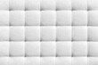 White suede leather background for the wall in the room. Interior design, headboards made of furniture fabric, furniture upholstery. Classic checkered pattern for furniture, wall, headboard