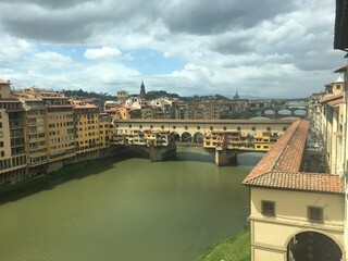 Ponte vecchio bridge, tuscany, florance with arno river, sunlights, colorful buildings