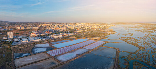 Canvas Print - Aerial view of the Ria Formosa park with salt pans in the Portuguese city of Faro. Sunny day