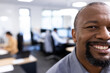 © wavebreak3 - Happy african american businessman looking at camera in office