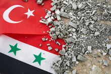 Turkey And Syria Earthquake, A Background Of The Turkish And Syria Flag And Brick Debris