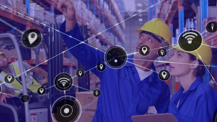 Poster - Animation of network of icons over caucasian male and female worker checking stock at warehouse