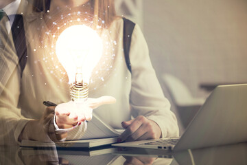 Poster - Double exposure of woman hands typing on computer and light bulb drawing. Idea concept.