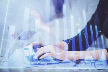 Poster - Multi exposure of woman hands typing on computer and financial graph hologram drawing. Stock market analysis concept.