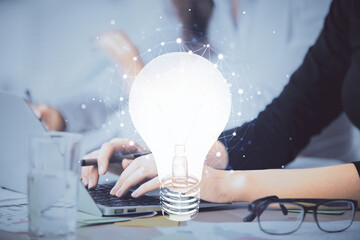 Poster - Double exposure of woman hands typing on computer and light bulb drawing. Idea concept.