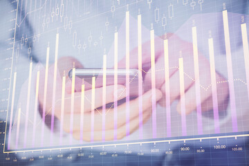 Poster - Double exposure of man's hands holding and using a digital device and forex graph drawing. Financial market concept.