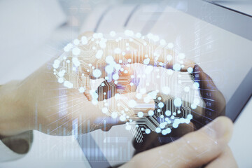 Fototapete - Double exposure of man's hand holding and using a digital device and brain hologram drawing. Data concept.