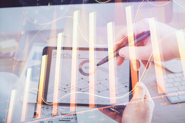 Aufkleber - Double exposure of man's hands holding and using a phone and financial chart drawing. Market analysis concept.