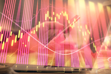 Poster - Double exposure of man's hands holding and using a phone and financial graph drawing. Analysis concept.
