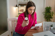 © Miljan Živković - one young woman read medical prescription hold medicine drugs at home