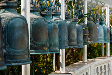 Wall Mural - Close up of a row of bells in the temple on the Golden Mount or Wat Saket in Bangkok in Thailand