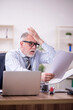 © Elnur - Old male employee and too much work at workplace