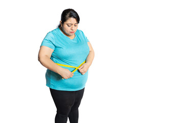 Wall Mural - Unhappy fat indian woman check belly with measuring tape isolated over white background. Full length, copy space. Loose weight concept.