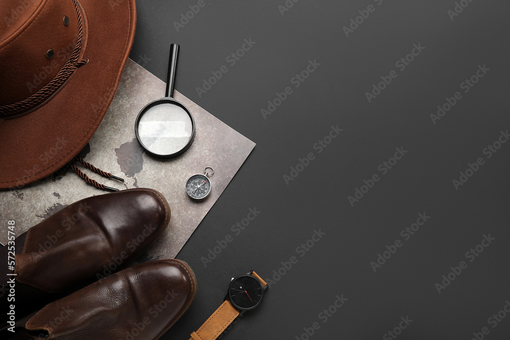Compass with traveler accessories on black background