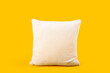 © Pixel-Shot - Soft pillow on yellow background