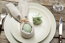 Table Setting With Easter Egg And Bunny On Wooden Background