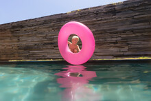 Boy With Inflatable Ring Near Swimming Pool
