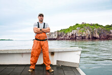 Portrait Of Proud Lobsterman On Boat In Casco Bay