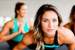 © Cavan Images - Group of people doing yoga class, sports concept. Generative AI