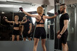 © rostyslav84 - Middle aged sporty woman is doing exercises with a personal coach in the gym