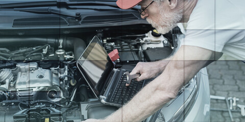 Wall Mural - Mechanic using laptop for checking car engine, geometric pattern