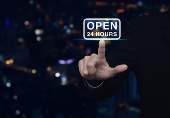 Canvas Print - Businessman pressing open 24 hours flat icon over blur colorful night light city tower and skyscraper, Business full time service concept