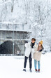 © CandyRetriever  - Asian couple holding passport during travel small village and forest mountain covered in snow together in snowy day. Global airline transportation and people travel Japan on winter holiday vacation.